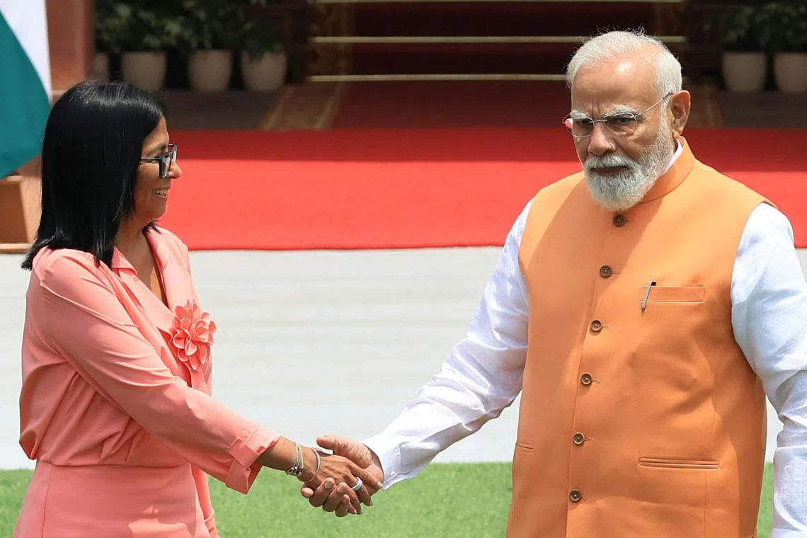 Venezuela's interim President Delcy Rodriguez shakes hands with India's Prime Minister Narendra Modi before their meeting at the Hyderabad House in New Delhi, India, June 4, 2026. REUTERS/Adnan Abidi