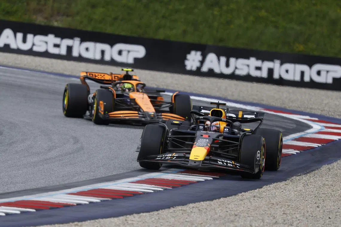 Red Bull driver Max Verstappen and McLaren's Lando Norris competing during the Austrian Grand Prix.