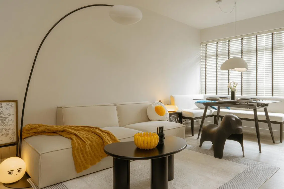 This playful three-room resale flat has plenty of space for its owners to showcase their interests.