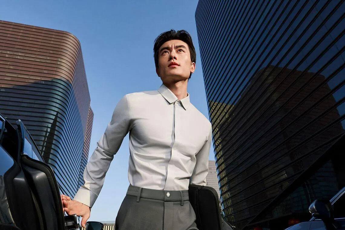 Hong Kong celebrity Nicholas Tse wearing Determinant Wrinkle-Free Bonded Snap-Front Shirt