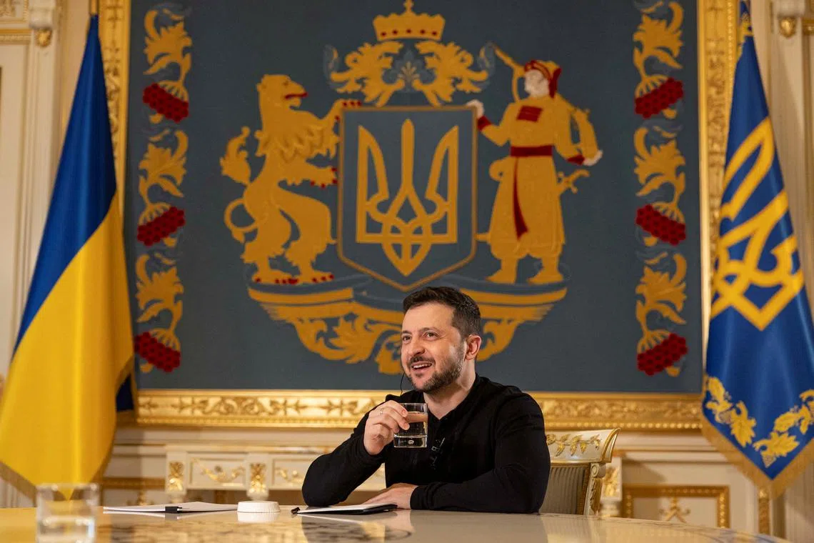 Ukraine's President Volodymyr Zelenskiy smiles during an interview with Reuters, amid Russia's attack on Ukraine, in Kyiv, Ukraine February 7, 2025. REUTERS/Valentyn Ogirenko