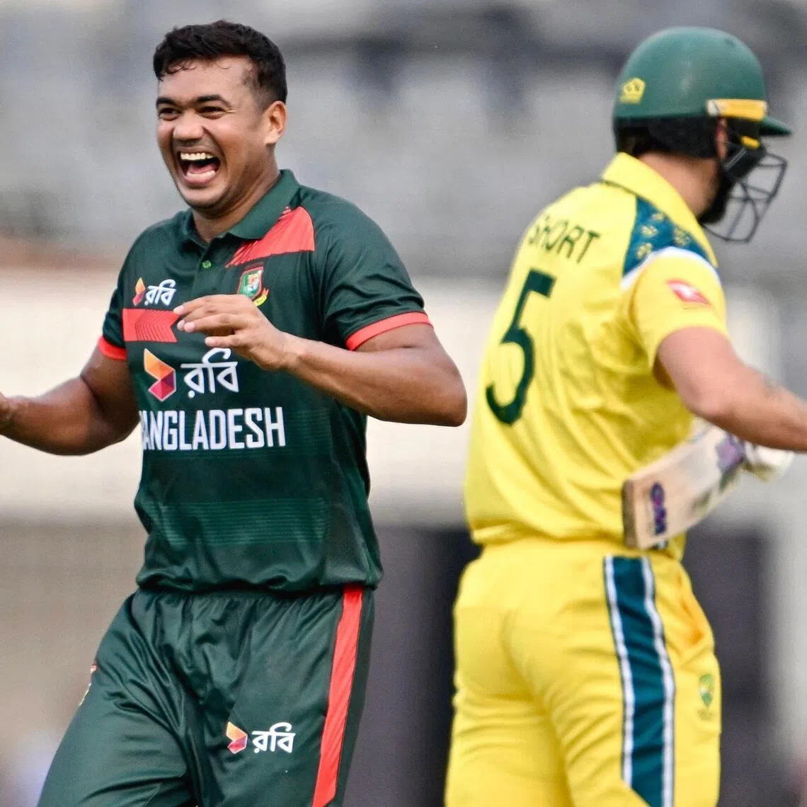 Bangladesh's Taskin Ahmed celebrates after taking the wicket of Australia's Matthew Short in the first one-day international (ODI) at the Sher-e-Bangla National Cricket Stadium in Dhaka on June 9, 2026.