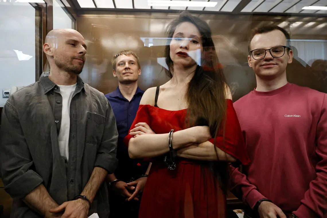 Journalists Sergei Karelin, Konstantin Gabov, Antonina Favorskaya and Artem Kriger, accused of taking part in the activities of an \"extremist\" organization founded by late opposition politician Alexei Navalny, attend a court hearing in Moscow, Russia April 15, 2025. REUTERS/Yulia Morozova