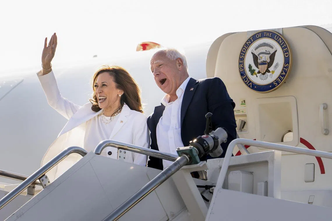 Vice President Kamala Harris, the Democratic presidential nominee, and Gov. Tim Walz of Minnesota, her running mate, wave from Air Force Two as they arrive at a campaign rally at the Detroit Metropolitan Wayne County Airport in Romulus, Mich., on Aug. 7, 2024. Lofty condemnations of Donald Trump have given way to mockery. A tough interview with a top journalist? That can wait. Above all, Democrats are in a surprising place: on offense. (Erin Schaff/The New York Times)
