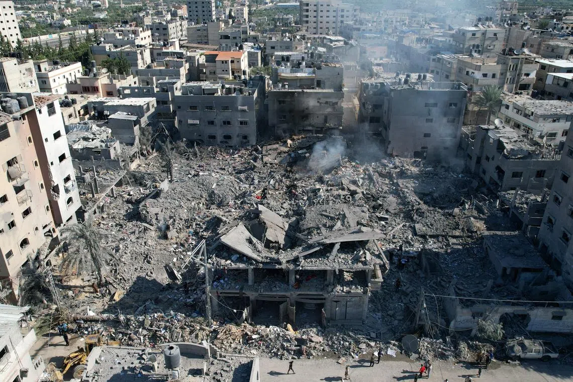 A view shows the site of Israeli strikes on houses in the central Gaza Strip October 18, 2023. REUTERS/Mohammed Fayq Abu Mostafa