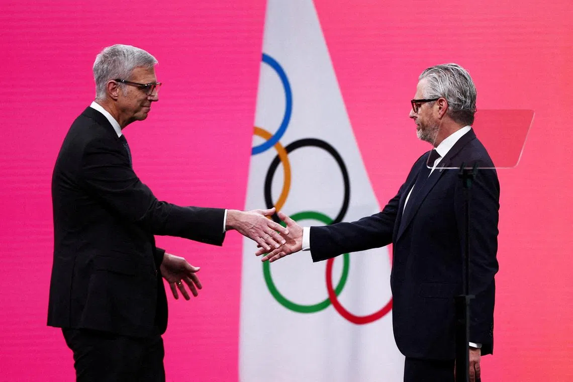 FILE PHOTO: Milano Cortina 2026 Winter Olympics - 145th IOC Session - Auditorium MPC, Milan, Italy - February 3, 2026 Chairman of the Los Angeles Organizing Committee for the 2028 Olympic and Paralympic Games, Casey Wasserman with Reynold Hoover, chief executive officer of the 2028 Summer Olympics during the 145th IOC Session REUTERS/Guglielmo Mangiapane/File Photo