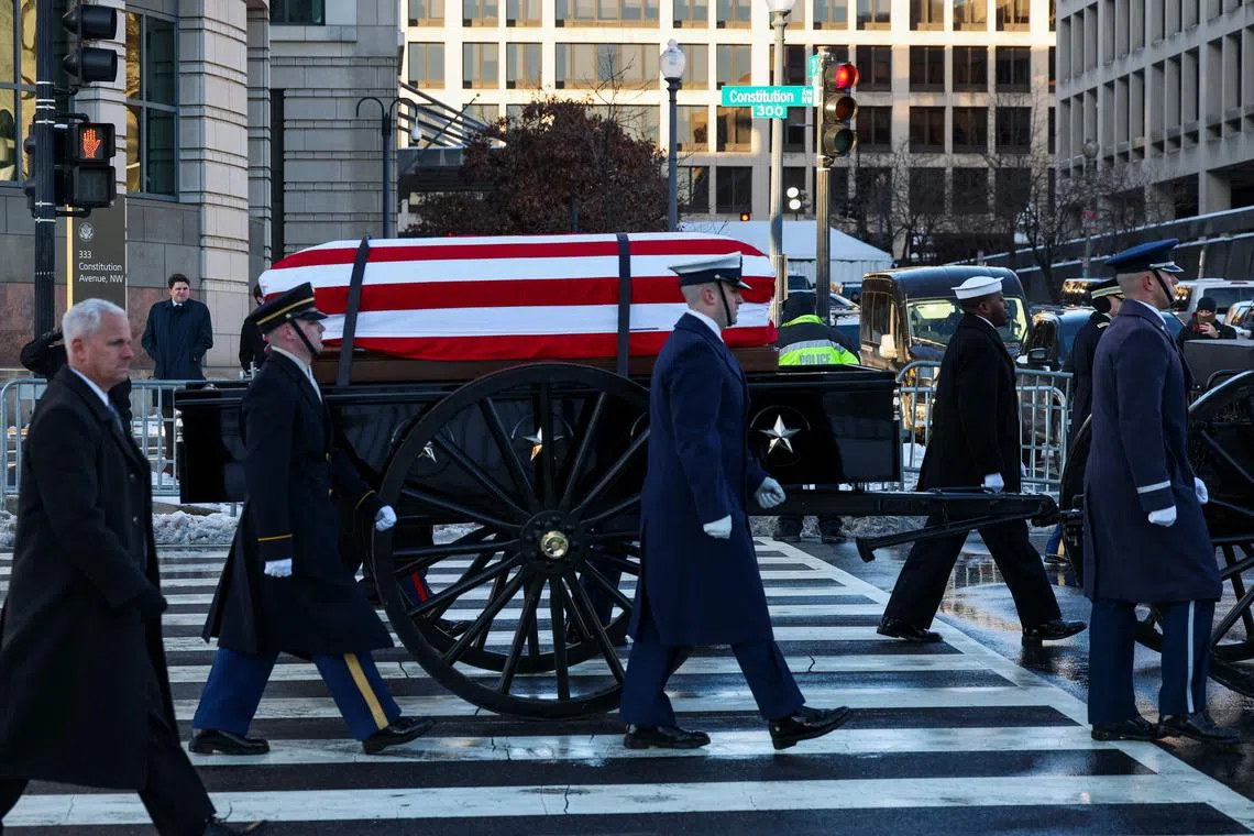 The US Army's Caisson Detachment carrying the casket of Jimmy Carter to lie in state at the US Capitol building in Washington, DC, on Jan 7.