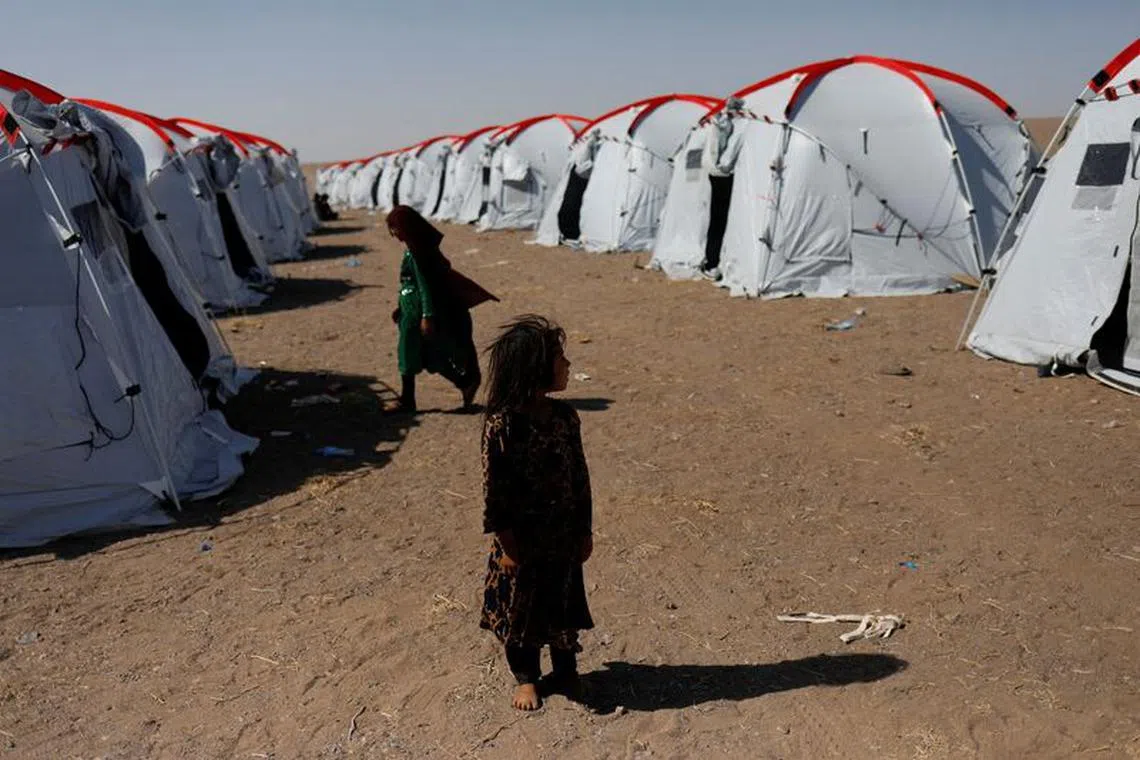 Atefeh, 6, an Afghan girl who says she lost her father and brother in the recent earthquake, poses for a photograph at the Red Crescent camp in district of Zinda Jan, in Herat, Afghanistan October 10, 2023. REUTERS/Ali Khara