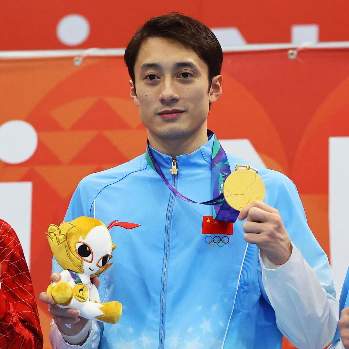 China’s Lian Junjie (centre) on the podium after winning the men’s 10m platform with silver medallist Rikuto Tamai of Japan and bronze medallist Zhao Renjie of China.