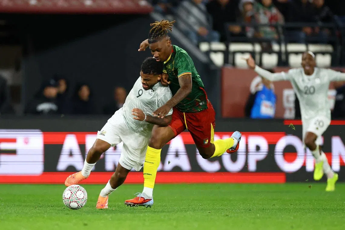 Soccer Football - CAF Africa Cup of Nations - Morocco 2025 - Round of 16 - South Africa v Cameroon - Al Medina Stadium, Rabat, Morocco - January 4, 2026 South Africa's Lyle Foster in action with Cameroon's Christopher Wooh REUTERS/Siphiwe Sibeko