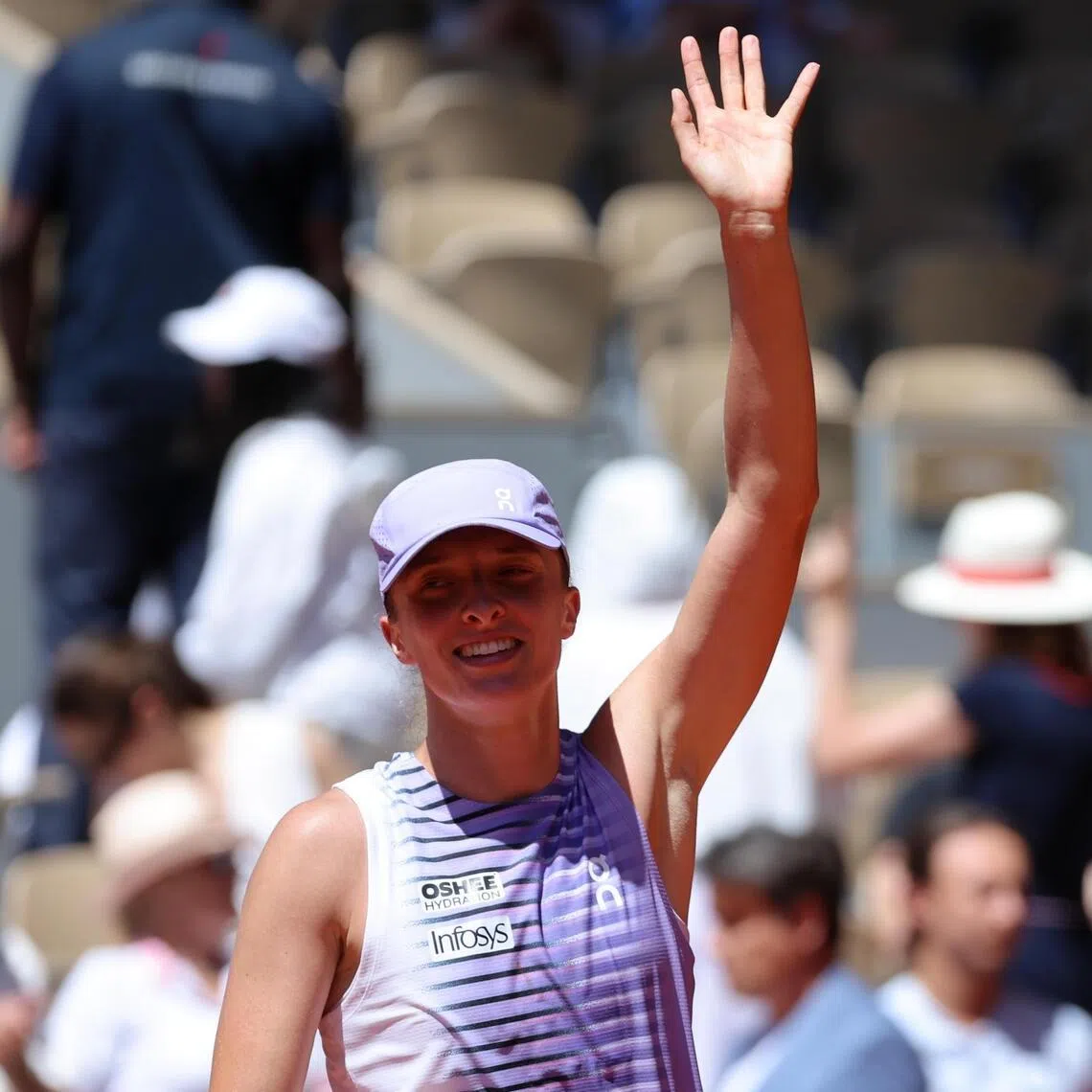 Iga Swiatek of Poland celebrates after winning her French Open second-round match against Sara Bejlek of the Czech Republic.