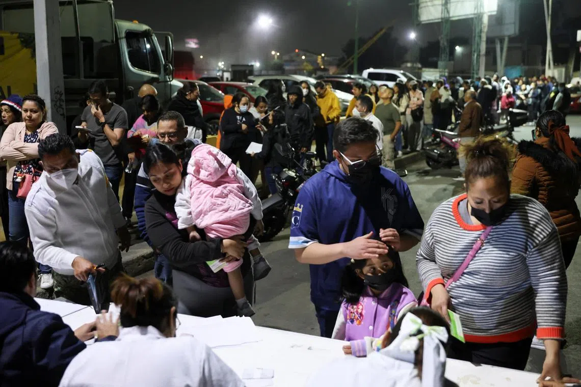 People queue to receive the measles vaccine at the Central de Abasto wholesale market, as health authorities in Mexico launch vaccination campaigns to curb a surge in cases and prevent wider regional transmission, in Mexico City, Mexico, February 11, 2026. REUTERS/Luis Cortes
