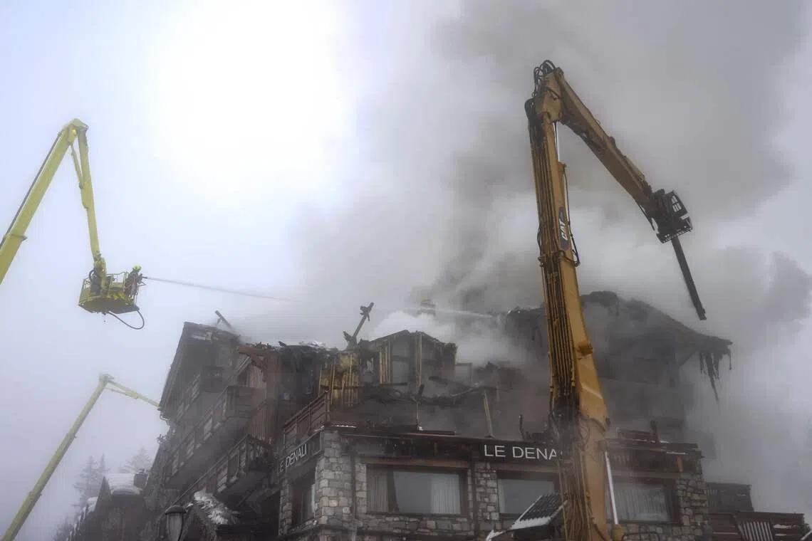  Firefighters working on a fire that broke out the evening before at the five-star Grandes Alpes hotel in the upscale French Alpine ski resort of Courchevel, France forcing the evacuation of 83 occupants, on Jan 28, 2026. 
