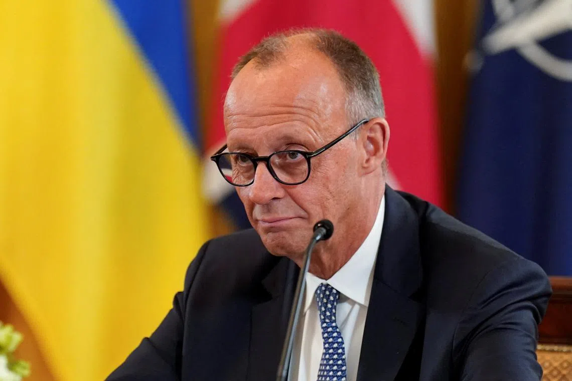 German Chancellor Friedrich Merz attends a meeting with U.S. President Donald Trump, Ukrainian President Volodymyr Zelenskiy and other European leaders amid negotiations to end the Russian war in Ukraine, at the White House in Washington, D.C., U.S., August 18, 2025. REUTERS/Al Drago