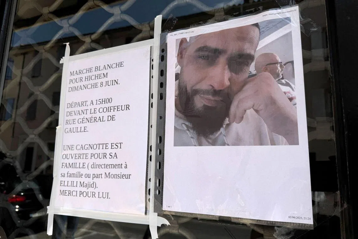 A portrait and a call for a tribute march, outside the hair salon where Hichem Miraoui used to work before he was shot dead by his neighbour. 