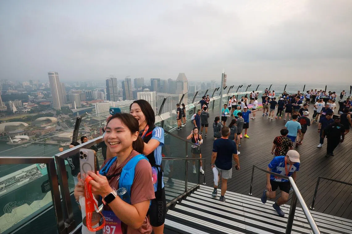 Participants taking in the view a the top of Marina Bay Sands SkyPark.