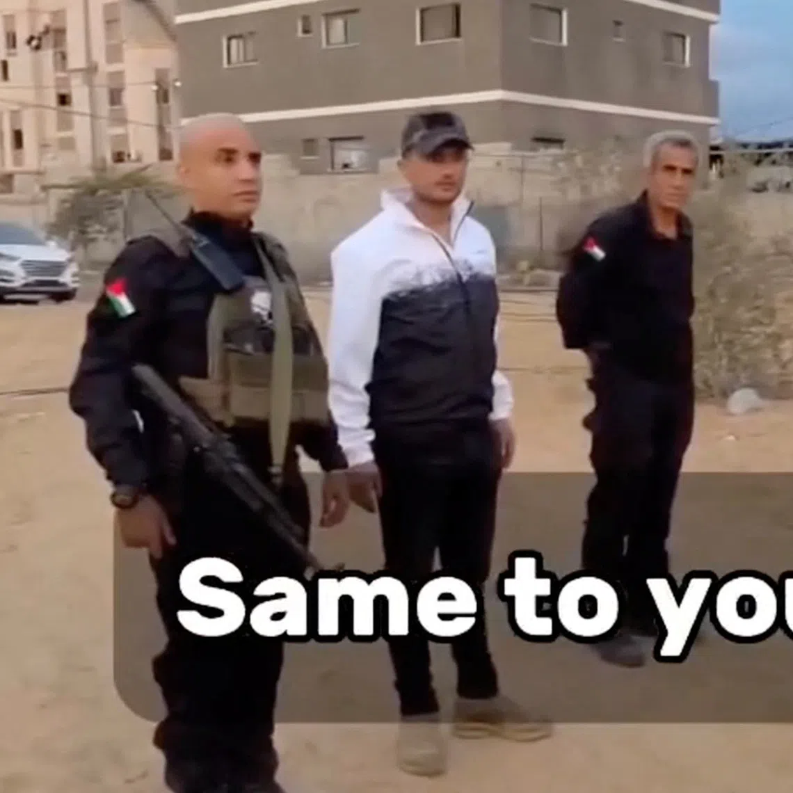 Leader of the Popular Forces Yasser Abu Shabab and his deputy Ghassan Al-Duhaini stand next to armed men in Rafah, in the southern Gaza Strip, in this screenshot taken from a video released on November 18, 2025. Yasser Abu Shabab/Popular Forces via REUTERS