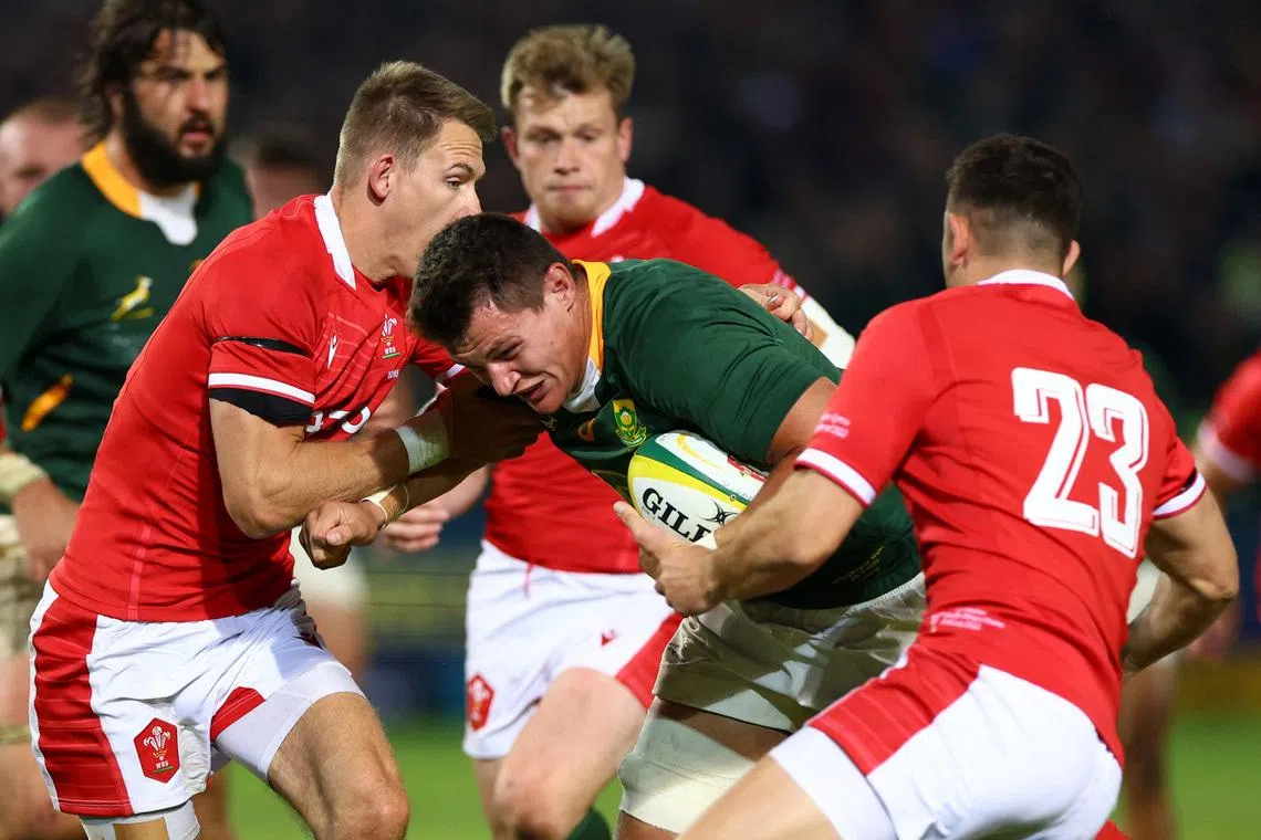 Rugby Union - First Test - South Africa v Wales - Loftus Versfeld, Pretoria, South Africa - July 2, 2022 South Africa's Elrigh Louw in action with Wales's Liam Williams and Owen Watkin REUTERS/Siphiwe Sibeko