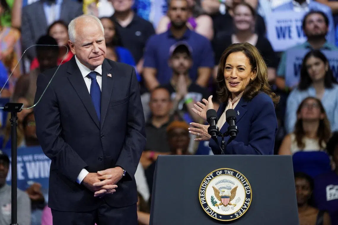 U.S. Vice President and Democratic presidential candidate Kamala Harris speaks next to her newly chosen vice presidential running mate Minnesota Governor Tim Walz during a campaign rally in Philadelphia, Pennsylvania, U.S., August 6, 2024. REUTERS/Kevin Lamarque