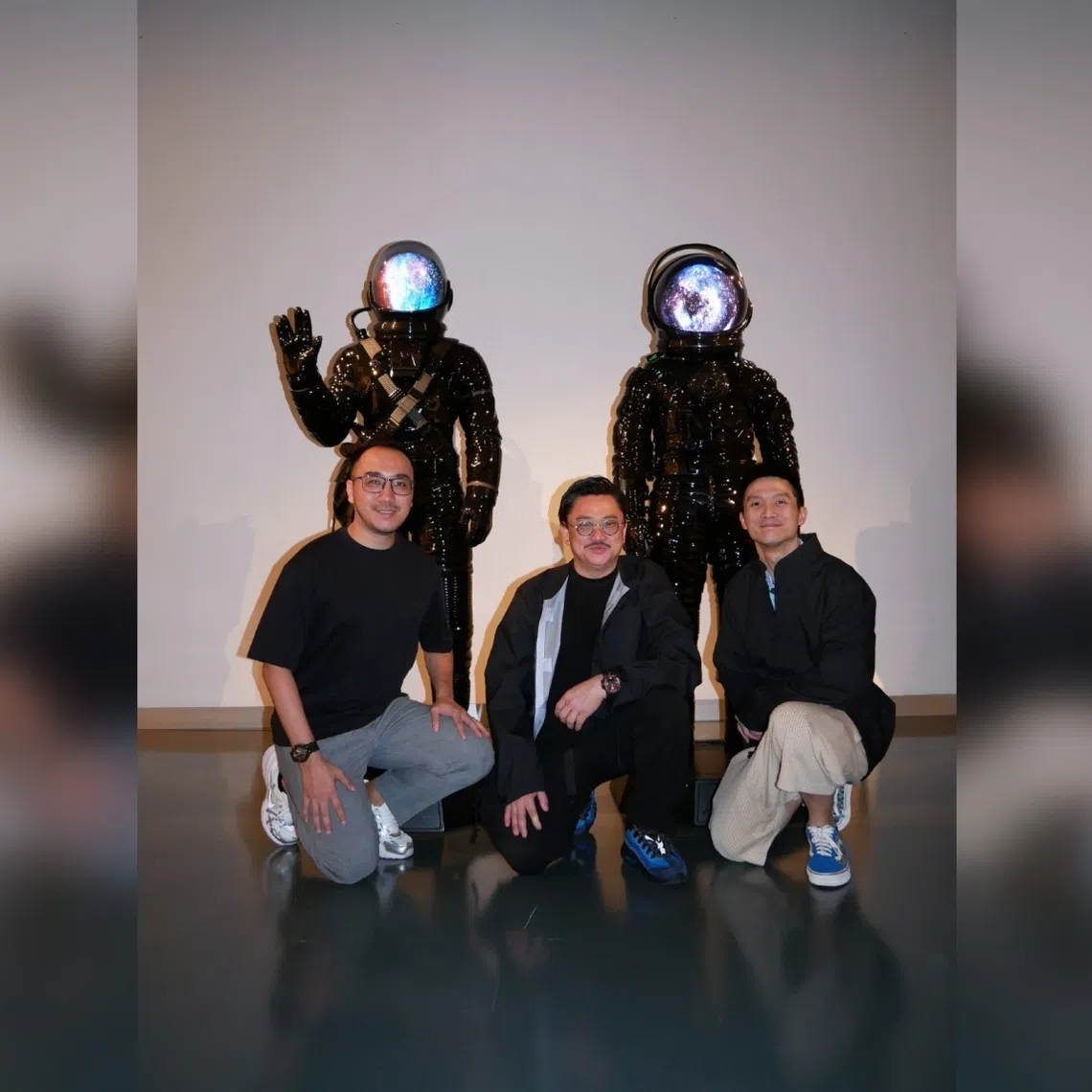Artist Jahan Loh (centre), founder of ArtCEO Jonathan Toh (left) and co-founder of ACU Michael Chung (right) with Loh's sculptures at Le Freeport. 