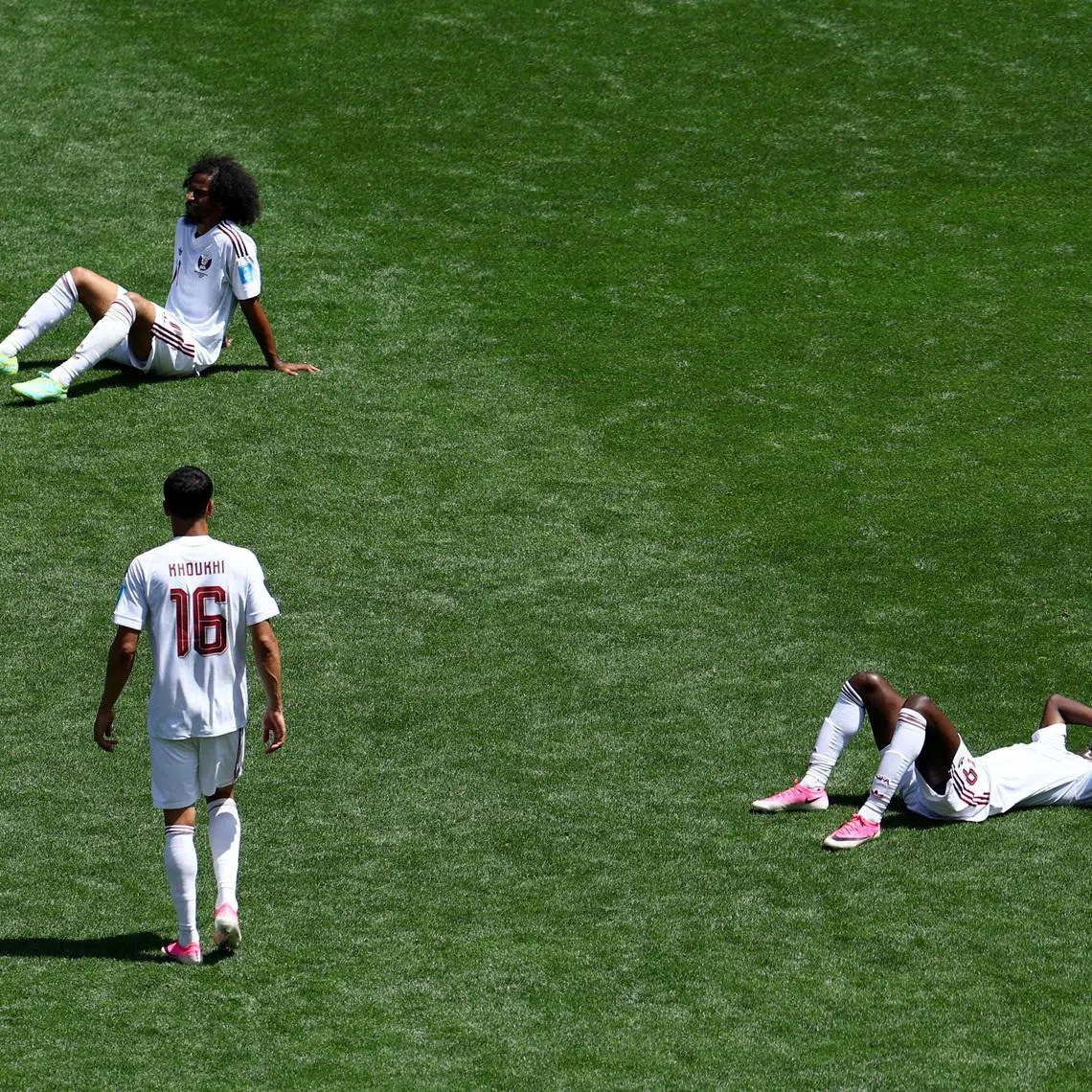 Soccer Football - FIFA World Cup 2026 - Group B - Bosnia and Herzegovina v Qatar - Seattle Stadium, Seattle, Washington, U.S. - June 24, 2026 Qatar's Akram Afif, Almoez Ali and Boualem Khoukhi look dejected after the match REUTERS/Eloisa Lopez