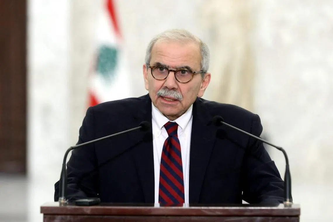 This handout picture released by the Lebanese presidency shows designate Prime Minister Nawaf Salam delivering a statement to the press at the presidential palace in Baabda, east of Beirut on February 8, 2025. Lebanon's presidency announced on February 8, that a new government had been formed, ending more than two years of an interim cabinet. President Joseph Aoun signed three decrees, the presidency said in a post on X, one "accepting the resignation of (caretaker) prime minister Najib Mikati's government", another "appointing Prime Minister Nawaf Salam to form the government", and a final one "to form a government of 24 ministers". (Photo by Lebanese Presidency / AFP) / RESTRICTED TO EDITORIAL USE - MANDATORY CREDIT "AFP PHOTO / HANDOUT / LEBANESE PRESIDENCY" - NO MARKETING NO ADVERTISING CAMPAIGNS - DISTRIBUTED AS A SERVICE TO CLIENTS