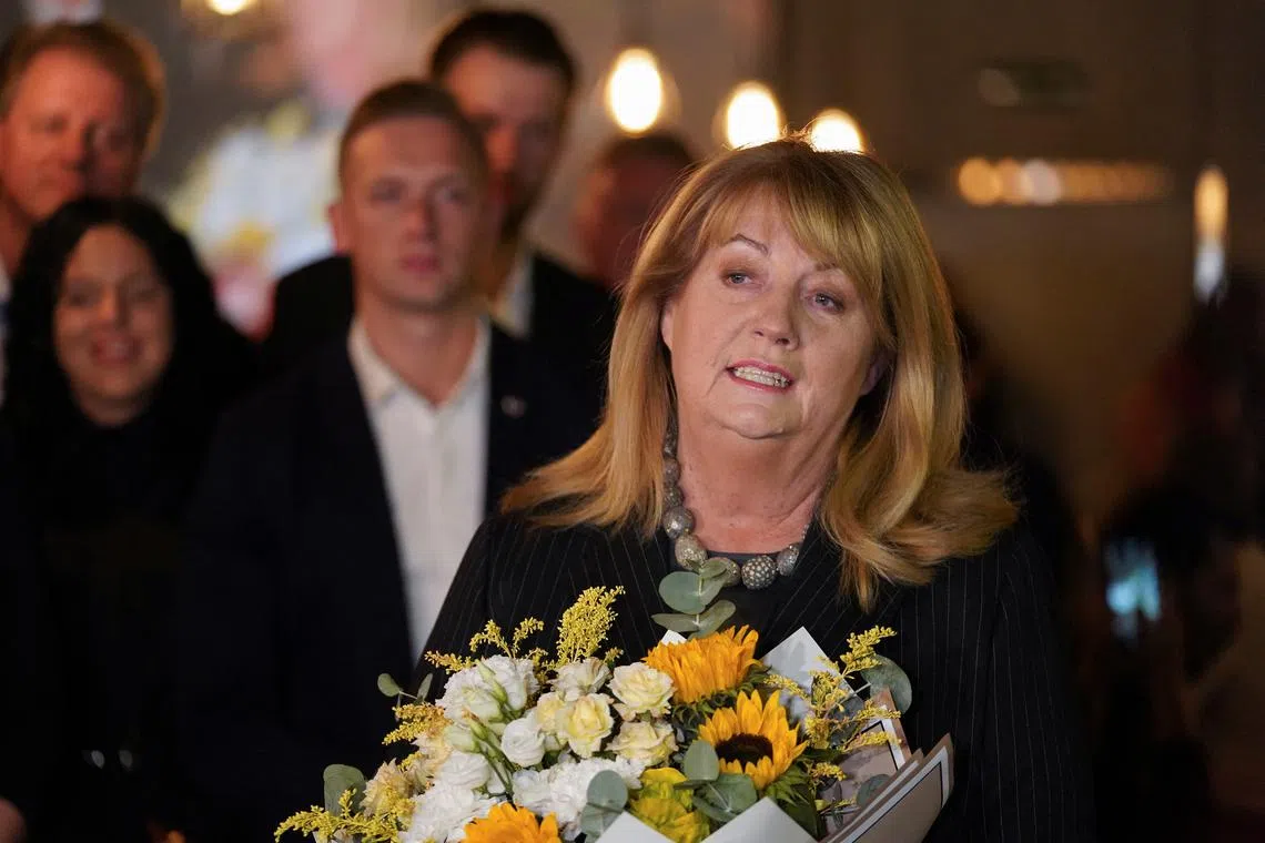 Leader of Social Democrats Vilija Blinkeviciute speaks to the media after the first round of Lithuanian parliamentary elections in Vilnius, Lithuania, October 13, 2024. REUTERS/Janis Laizans