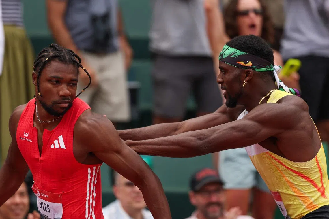 Noah Lyles (left) had angered Kenny Bednarek by turning his head to stare down his rival just before he took the tape.