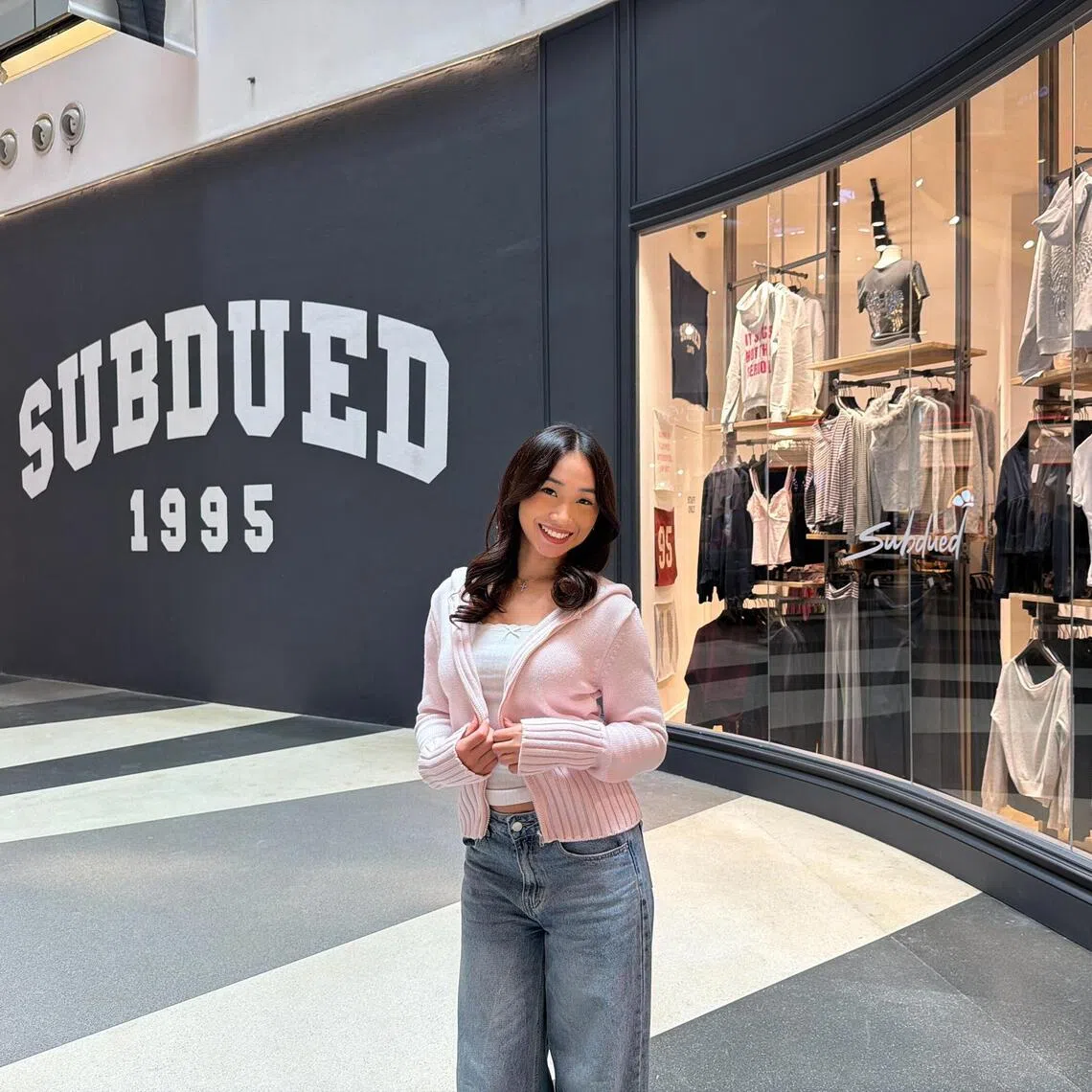 Content creator Sarah Lim, 20, outside Subdued’s Bugis+ store in a pink knit jacket from the label, which she wears almost every day.