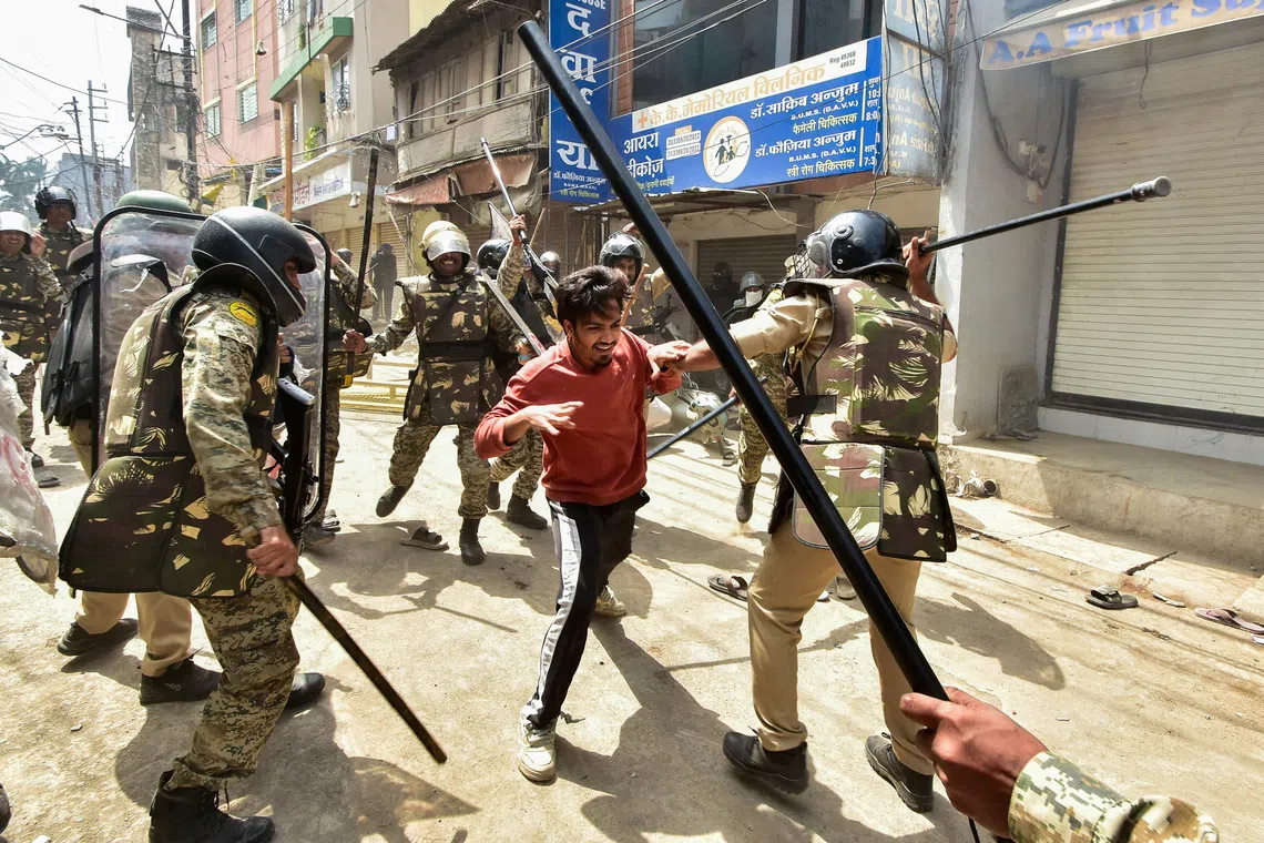 Police officers wield batons as they disperse protesters during a demonstration over the Shahi Masjid dispute in Ujjain, Madhya Pradesh, India, September 28, 2026. REUTERS/Stringer TPX IMAGES OF THE DAY