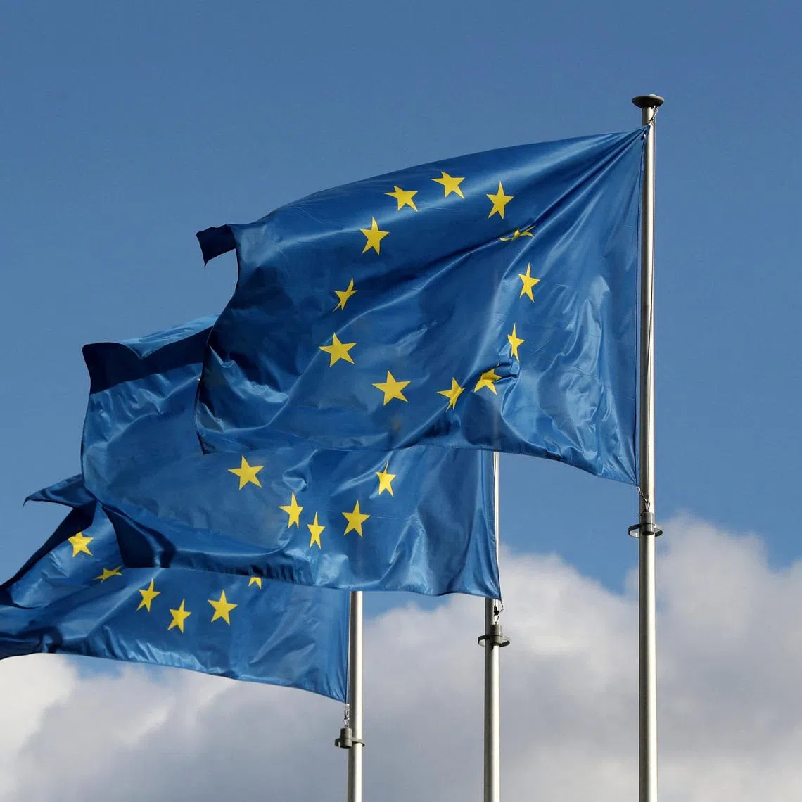 FILE PHOTO: European Union flags fly outside the EU Commission headquarters in Brussels, Belgium September 19, 2019. REUTERS/Yves Herman/File Photo