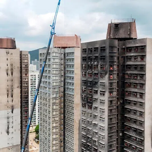 A drone view shows Wang Fuk Court apartment complex after a deadly fire last year, in Hong Kong, China, on April 16, 2026.