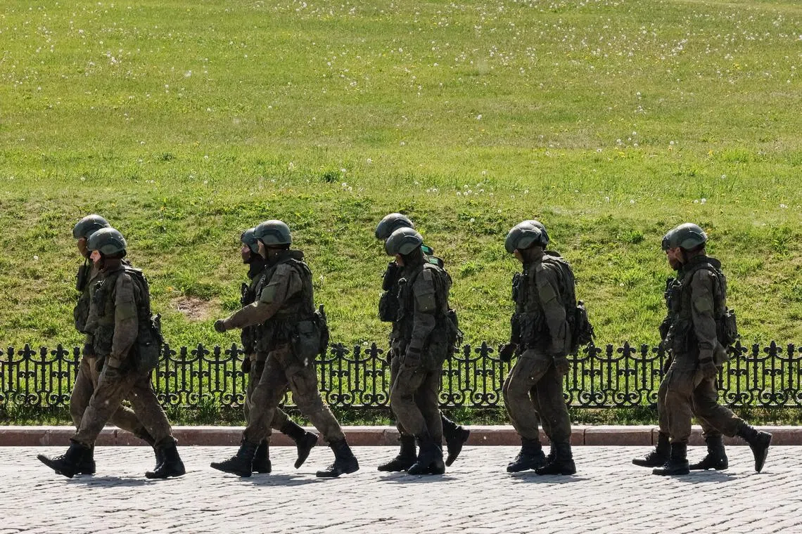 Russian army servicemen walk at an exhibition displaying armoured vehicles and equipment captured by the Russian army from Ukrainian forces in the course of Russia-Ukraine conflict, at Victory Park open-air museum on Poklonnaya Gora in Moscow, Russia May 31, 2024.  REUTERS/Shamil Zhumatov/File photo