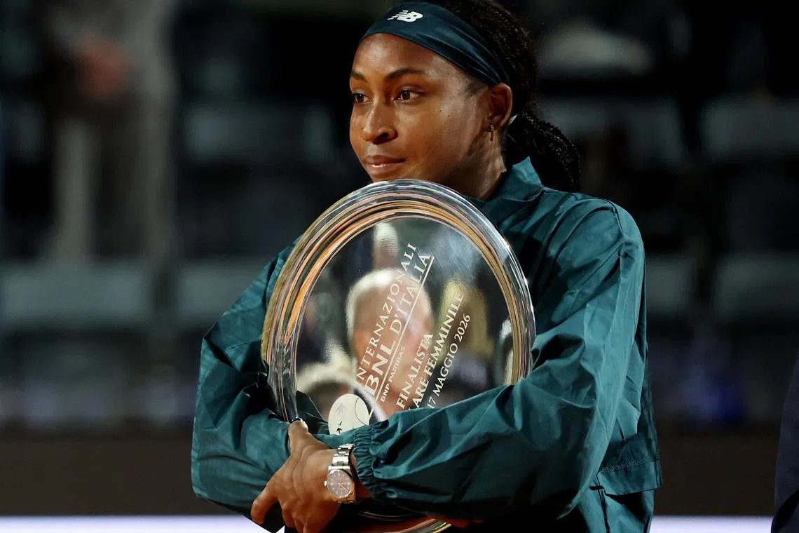 Tennis - Italian Open - Foro Italico, Rome, Italy - May 16, 2026 Coco Gauff of the U.S. celebrates with the runners-up trophy after the women's final match against Ukraine's Elina Svitolina REUTERS/Claudia Greco