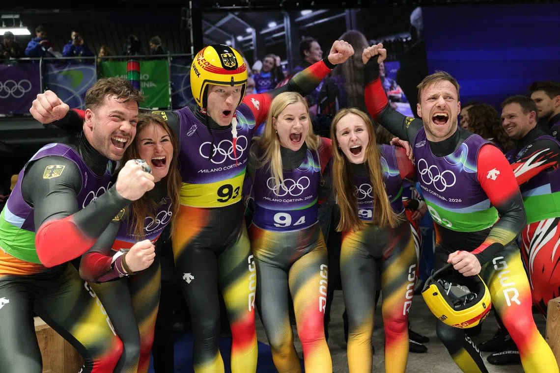 Milano Cortina 2026 Olympics - Luge - Team Relay - Cortina Sliding Centre, Cortina d'Ampezzo, Italy - February 12, 2026. Julia Taubitz of Germany, Tobias Wendl of Germany, Tobias Arlt of Germany, Max Langenhan of Germany, Dajana Eitberger of Germany and Magdalena Matschina of Germany celebrate winning gold in the Team Relay REUTERS/Athit Perawongmetha