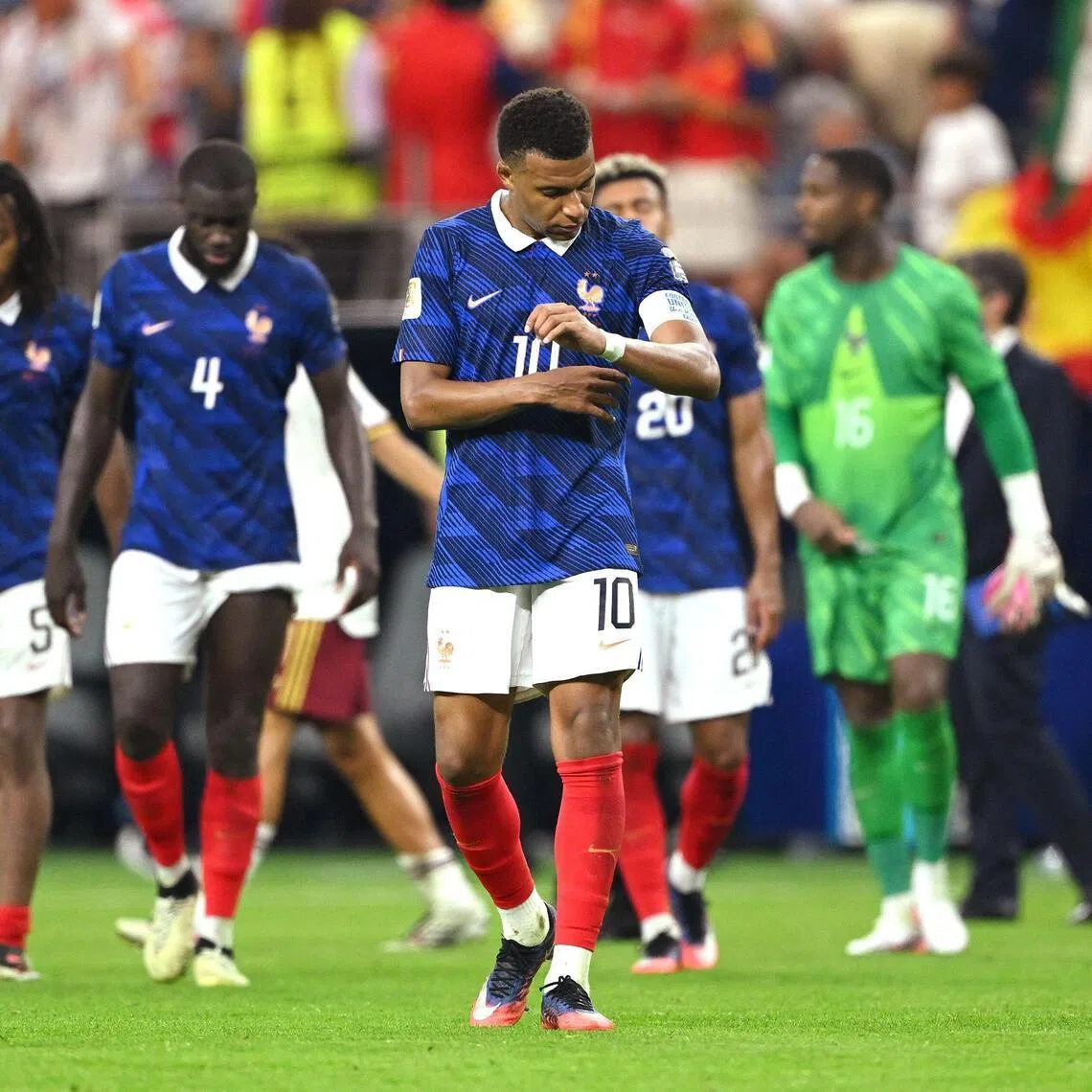 Kylian Mbappe and his France teammates are dejected after losing to Spain in the World Cup semi-finals.