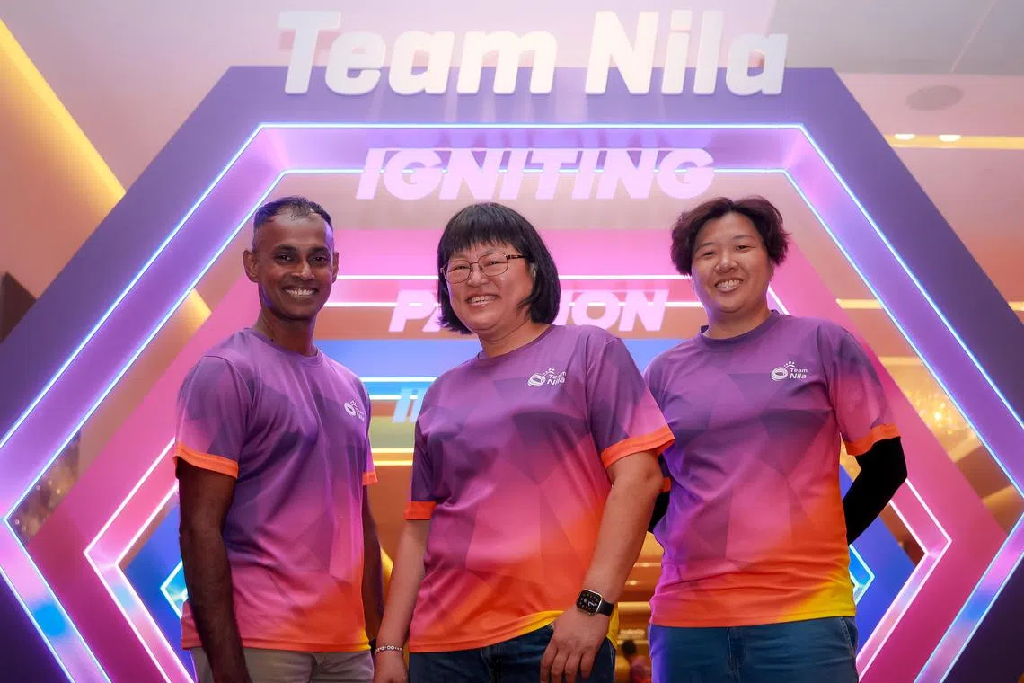 Team Nila award recipients Lim Hwee Leng, 53, (centre, gold award), Vijaikumar Rangabashayam, 50, (left, silver award) and Pearly Sim, 36, (right, bronze award) at the award ceremony held at Sands Convention & Exhibition Centre on Feb 24.