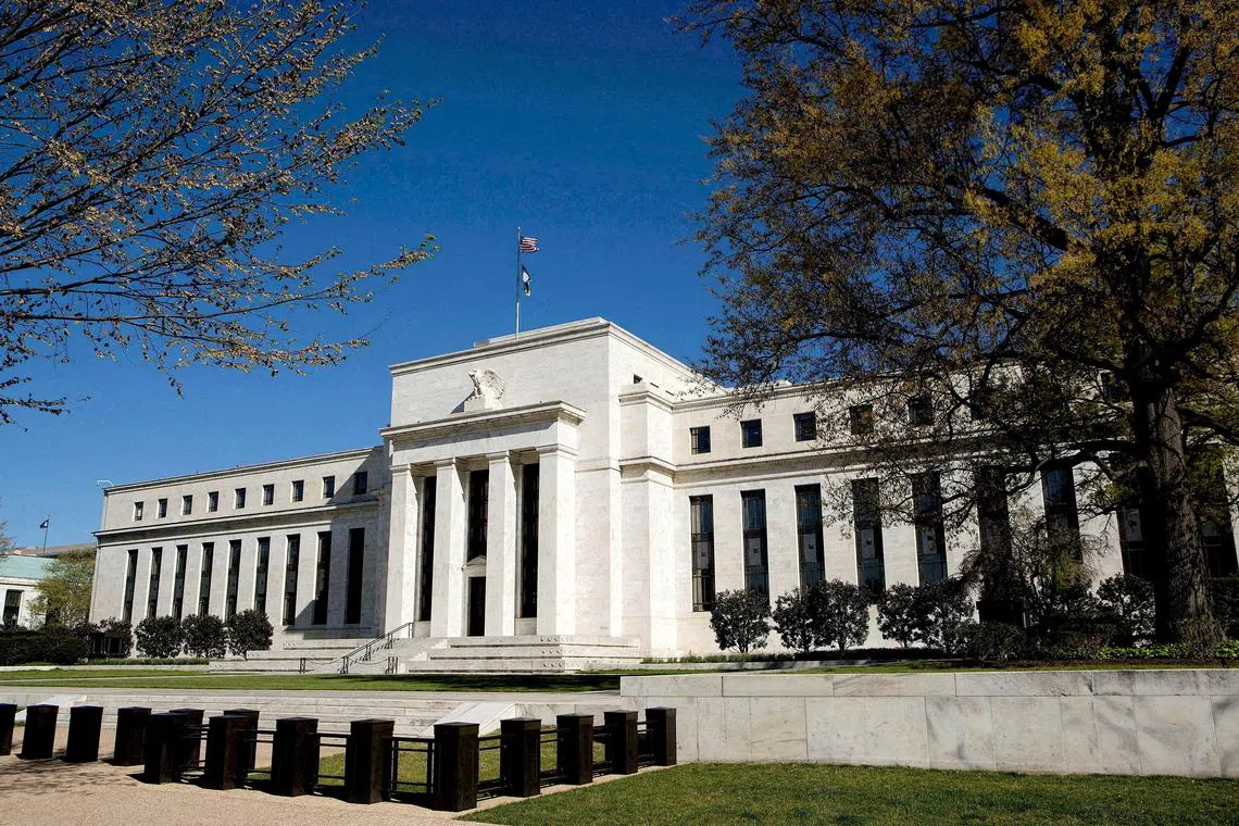 FILE PHOTO: The Federal Reserve Building stands in Washington April 3, 2012. REUTERS/Joshua Roberts/File Photo