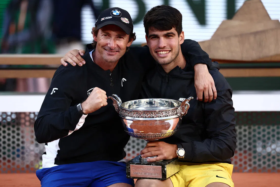 Tennis - French Open - Roland Garros, Paris, France - June 9, 2024 Spain's Carlos Alcaraz celebrates with coach Juan Carlos Ferrero after winning the men's singles final against Germany's Alexander Zverev REUTERS/Yves Herman