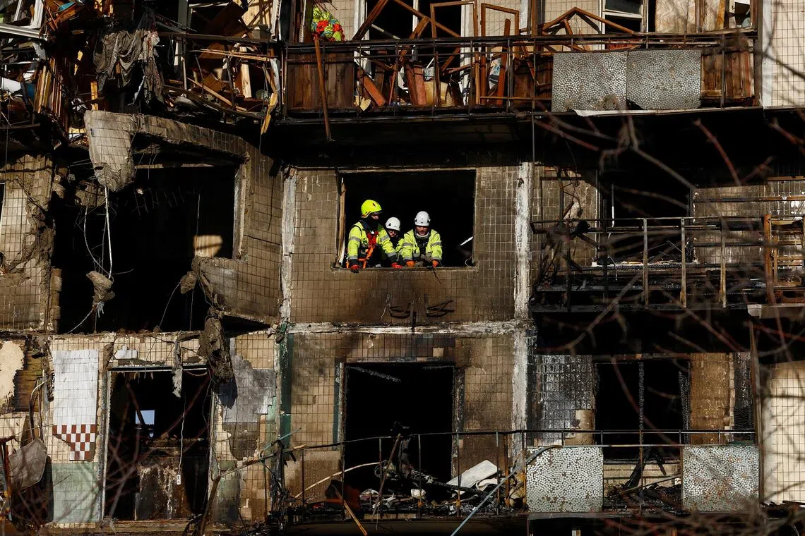 Rescuers work at the site of an apartment building hit during an overnight Russian drone and missile strikes, amid Russia's attack on Ukraine, in Kyiv, Ukraine, November 14, 2025. REUTERS/Valentyn Ogirenko     TPX IMAGES OF THE DAY     