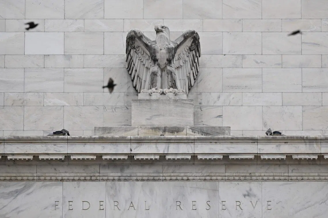 Birds fly past the US Federal Reserve in Washington, DC, on January 30, 2024. The US Federal Reserve was divided in January over the risks of cutting interest rates too soon or too late, although most members voiced concern about moving early, according to minutes of the meeting published February 21, 2024. (Photo by Mandel NGAN / AFP)