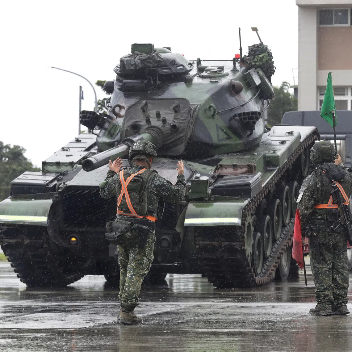 Taiwanese soldiers practise active-duty force expansion and military vehicle flatbed loading during the annual Han Kuang military exercises.