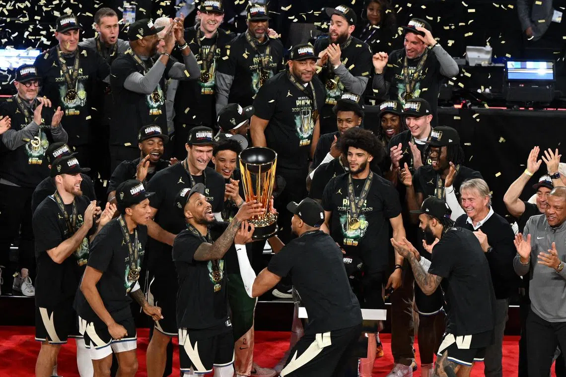 The Milwaukee Bucks celebrate after beating the Oklahoma City Thunder to win the NBA Cup.