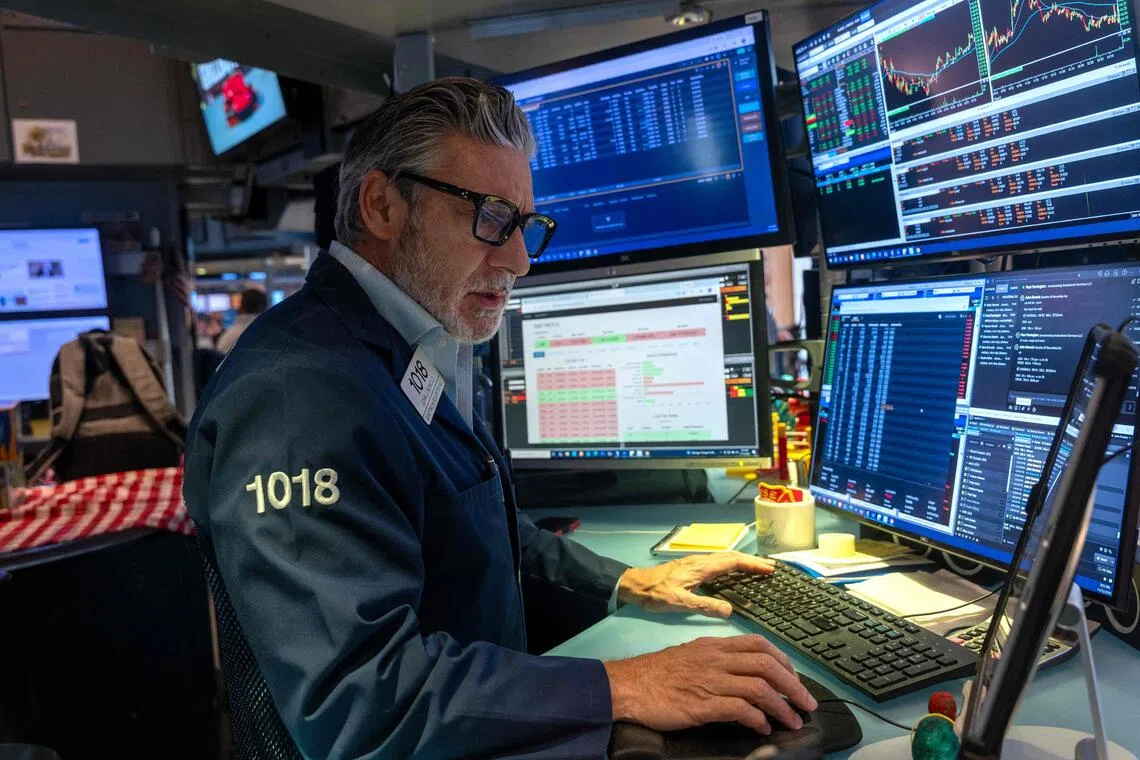 Traders working on the floor of the New York Stock Exchange on Nov 12, in New York City.
