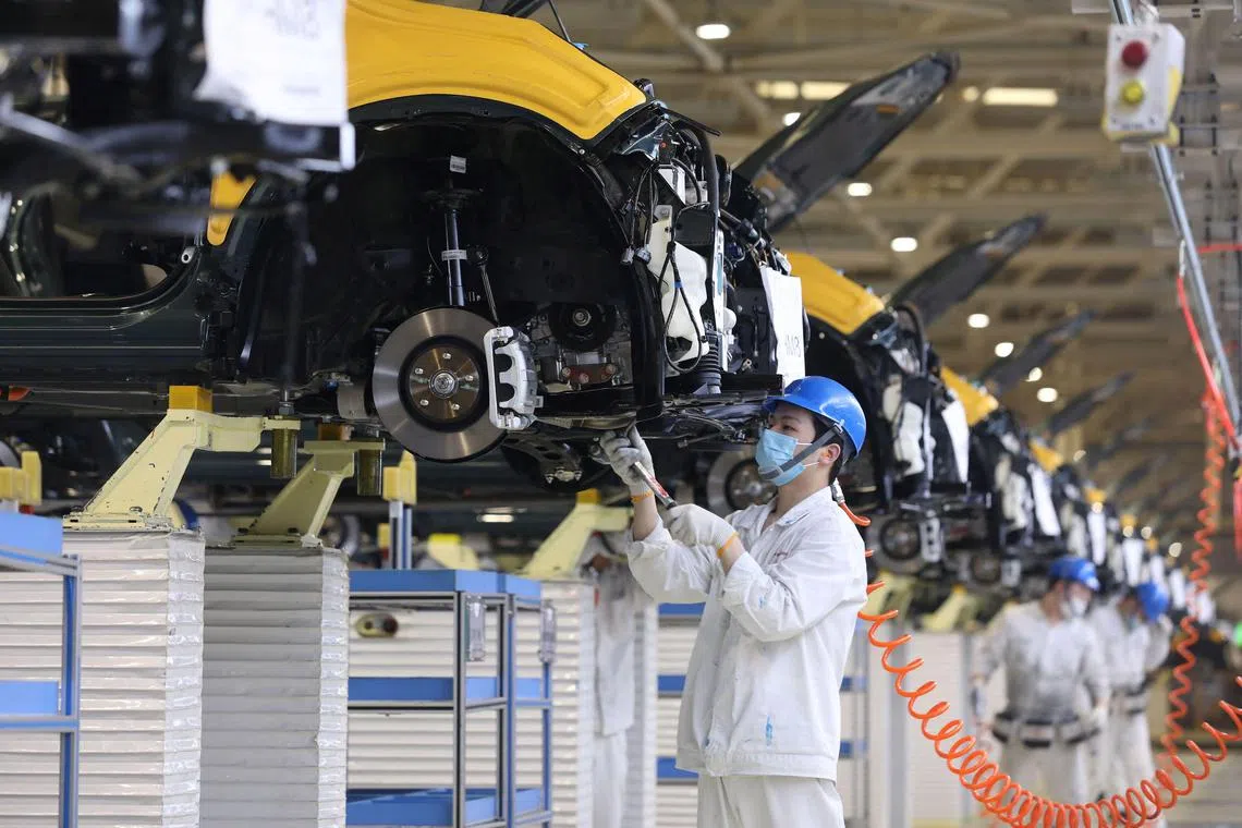 An employee working on an assembly line at an auto plant of Dongfeng Honda in Wuhan in China's central Hubei province. Japan’s Honda Motor Co. suspended its operations in Wuhan because of limitations around movement introduced in the area.
