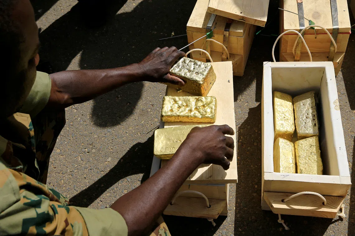 FILE PHOTO: Sudanese Rapid Support Forces (RSF) display gold bars seized from a plane that landed at Khartoum Airport in an investigation into possible smuggling, in Khartoum Sudan May 9, 2019. REUTERS/Mohamed Nureldin Abdallah/File Photo