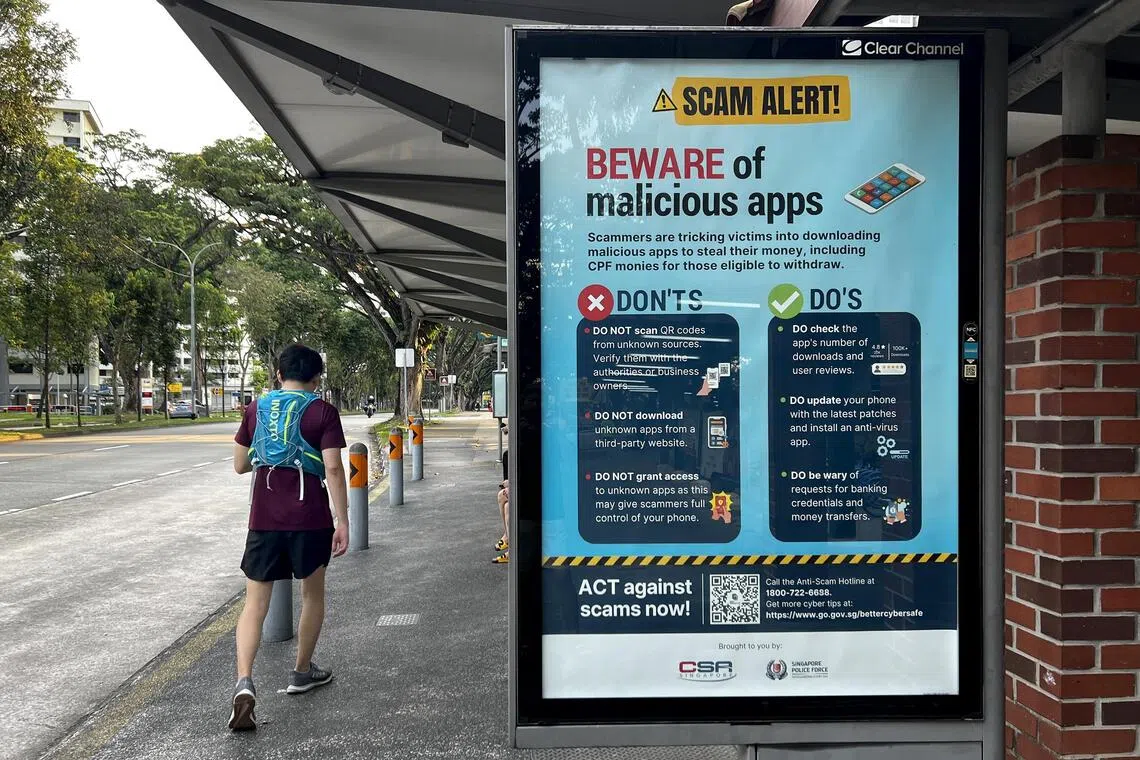 Scam alert advisory seen at a bus stop along Clementi Avenue 4, 15 September 2023. Can be used for stories on scams, anti-scam, malicious apps, scammers, clear channel, police advisory, polce