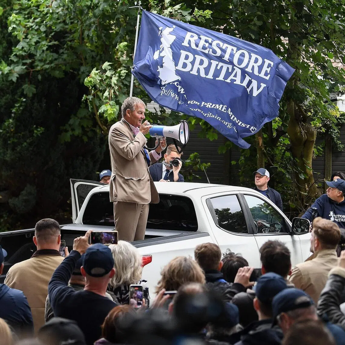 Businessman and ex-football chairman Rupert Lowe (standing) formed Restore Britain as an alternative on the right of British politics in February.