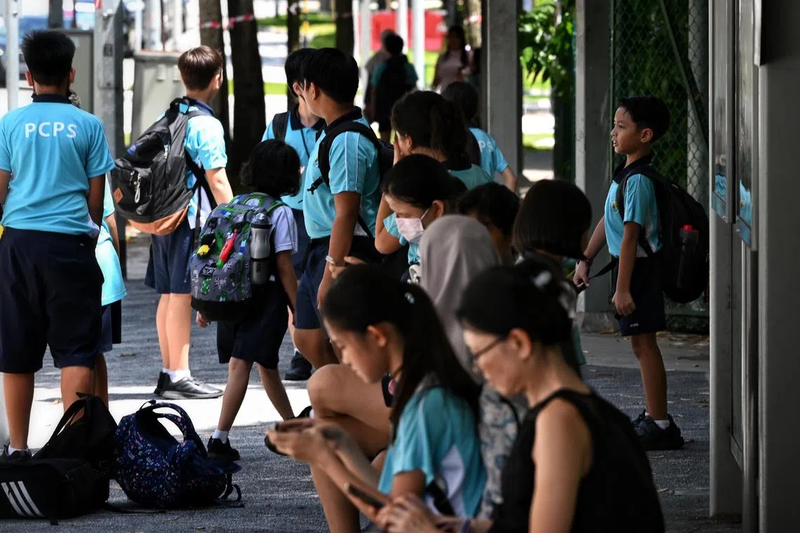 ST20230509_202399501439 Kua Chee Siong/ pixgeneric/ Generic pix of students from Punggol Cove Primary School at a bus stop along Sumang Link on May 09, 2023.