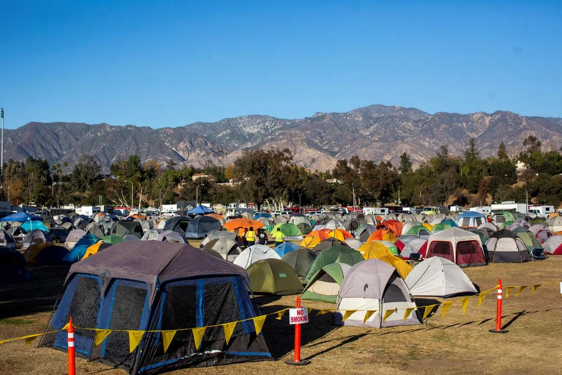 FILE PHOTO: Camping tents are seen at a staging ground at the Rose Bowl Stadium, while firefighters held the line against two massive wildfires that have ravaged parts of Los Angeles County, in Pasadena, California, U.S. January 14, 2025.     REUTERS/Ringo Chiu/File Photo